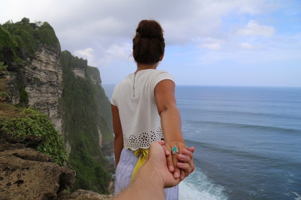 cliff, beach, holding hands-1846233.jpg